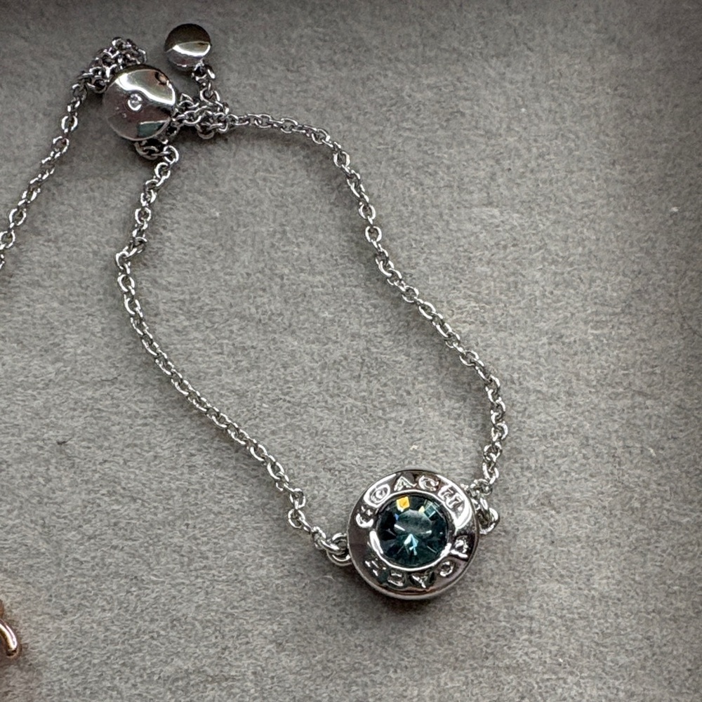 Elegant Silver and Blue Pendant Coach Bracelet